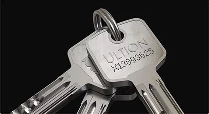 Close-up of a keychain with keys on a black background